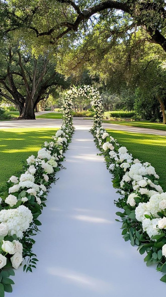 21 Dreamy Garden Wedding Decor Ideas 40 14. Enchanted flower-bordered ceremony aisle with lush greenery-0