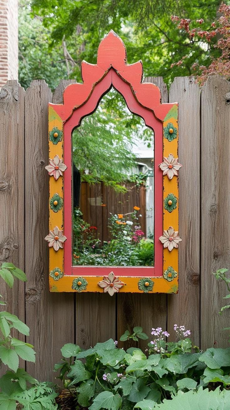 37 Magical Garden Ideas for a Whimsical Backyard 17 6. Upcycled mirror frame on garden fence-2
