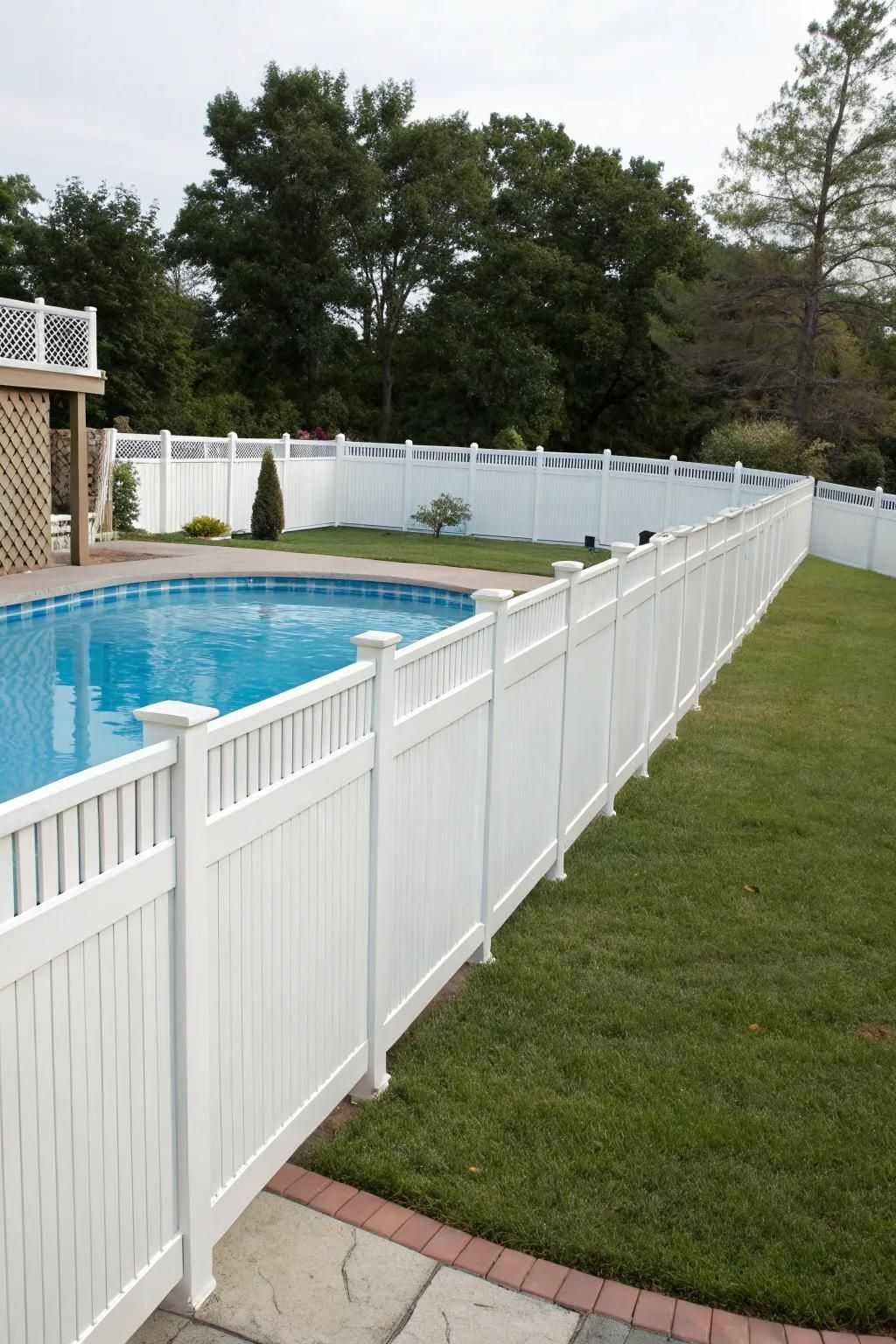 Vinyl fencing adds privacy and a touch of elegance to your pool deck.