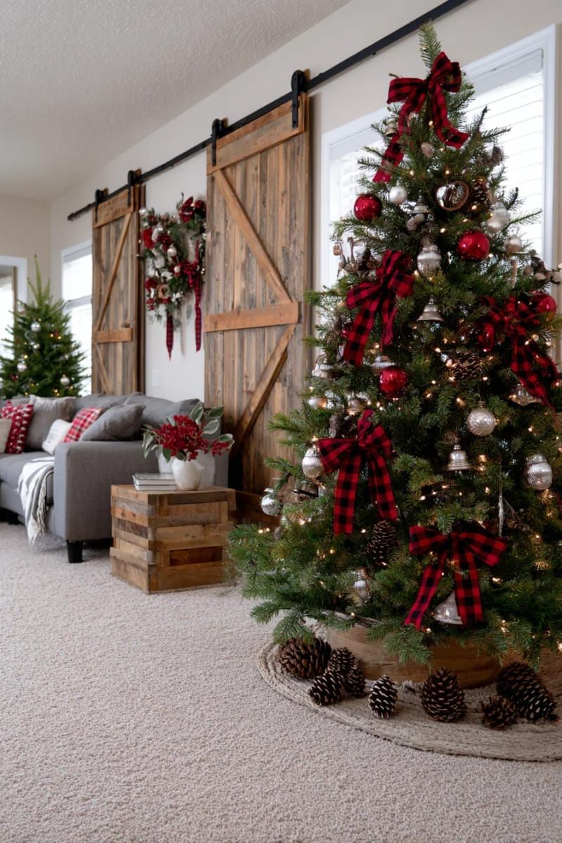 31 Cozy Rustic Decor Ideas for a Warm Xmas 55 barn door-inspired wall decor featuring metal bells and red plaid bows 1