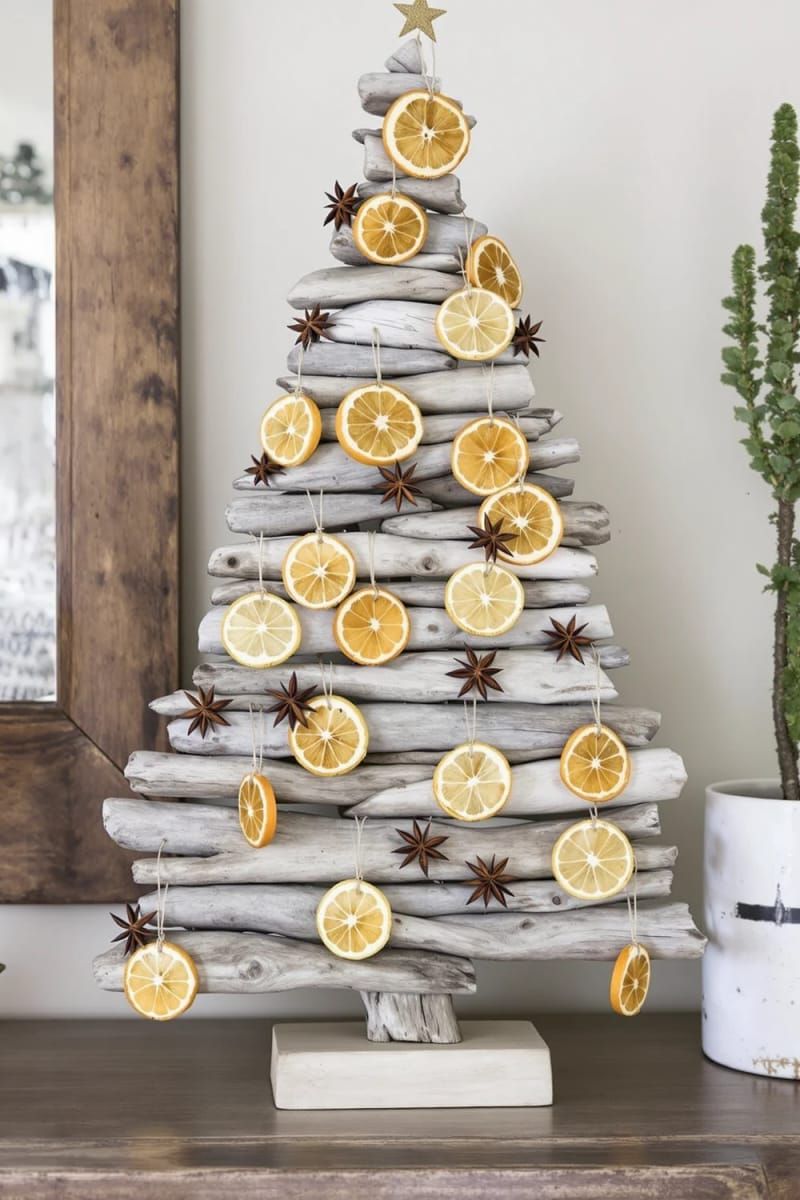 31 Cozy Rustic Decor Ideas for a Warm Xmas 53 driftwood christmas tree decorated with dried citrus and star anise 1