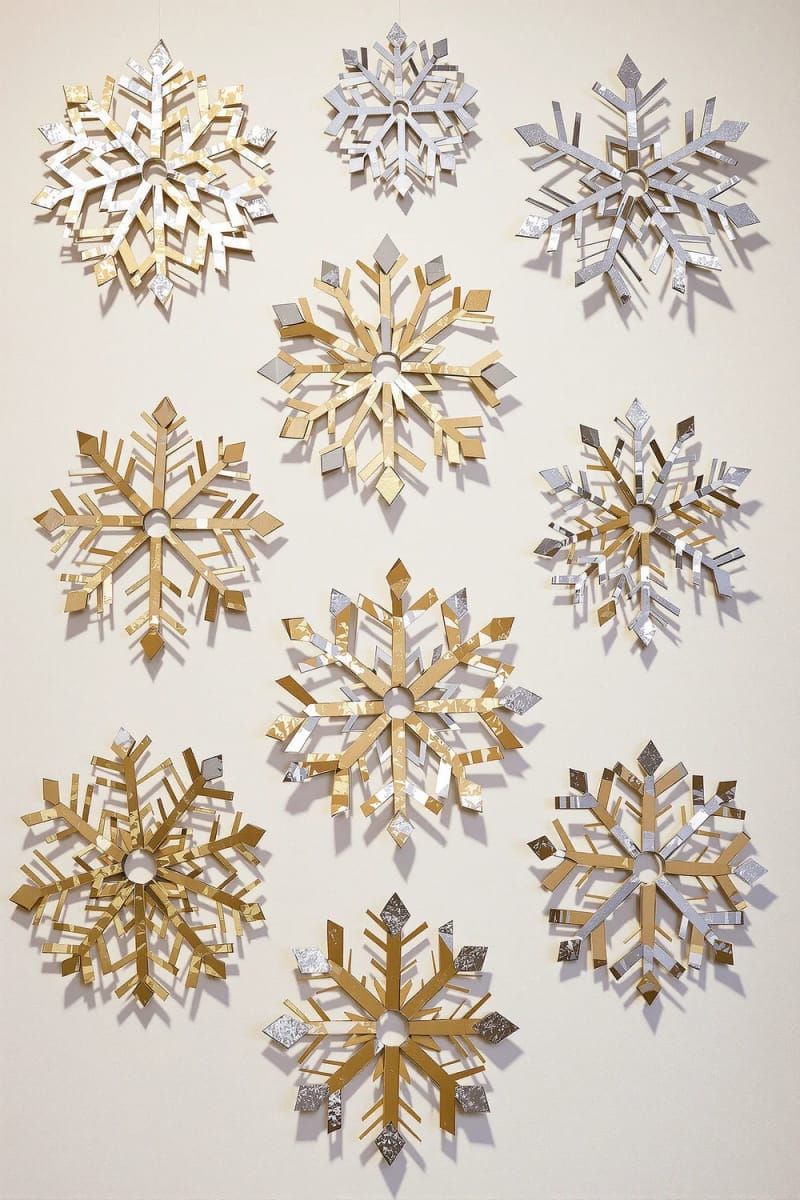 Dazzling DIY Xmas Decor: 31 Must-Try Ideas 41 toilet paper roll snowflakes painted metallic for budget wall art 1